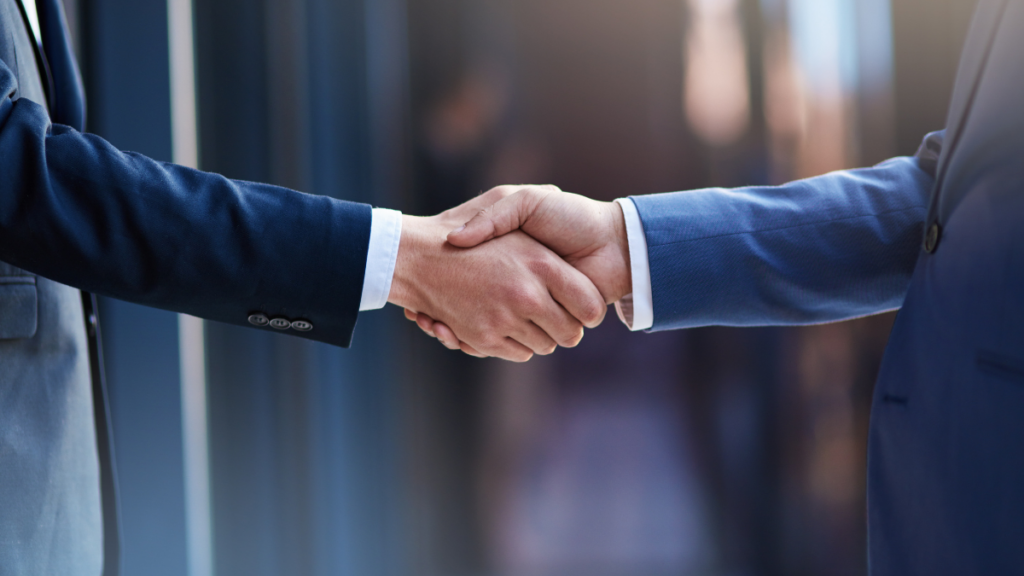 Two men shaking hands - symbol of building trust